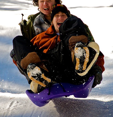 Travis Robinson and Seiji Goya of Boulder City Sled down a slope of Mt. Charleston