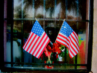Two flags in a window St. Augustine