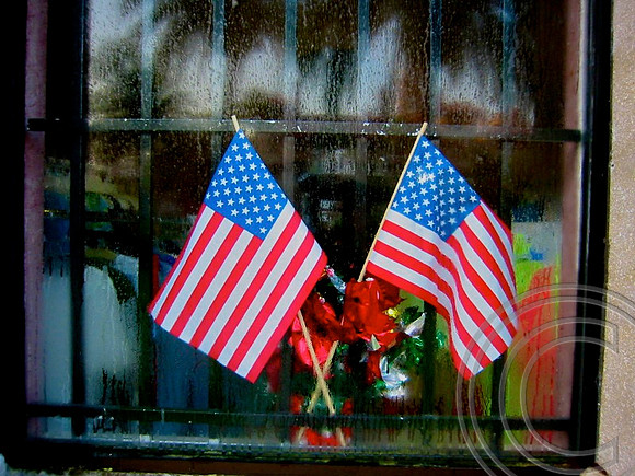 Two flags in a window St. Augustine